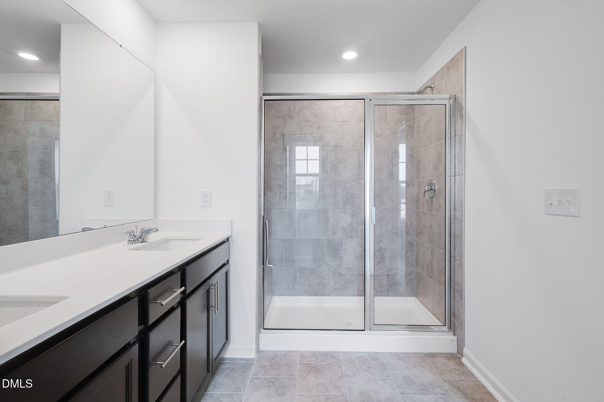 2939 Hickory Fld Drive Raleigh, NC 27616 - Photo 25 of 30 a bathroom with a shower and a sink