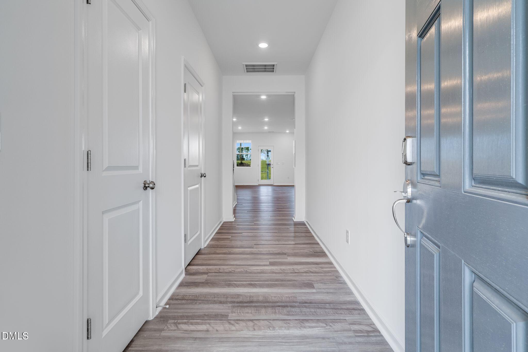 2939 Hickory Fld Drive Raleigh, NC 27616 - Photo 3 of 30 a view of a hallway with wooden floor