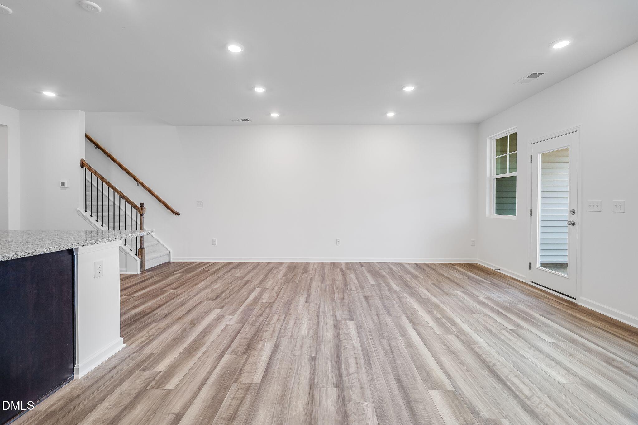 2939 Hickory Fld Drive Raleigh, NC 27616 - Photo 5 of 30 a view of empty room with wooden floor