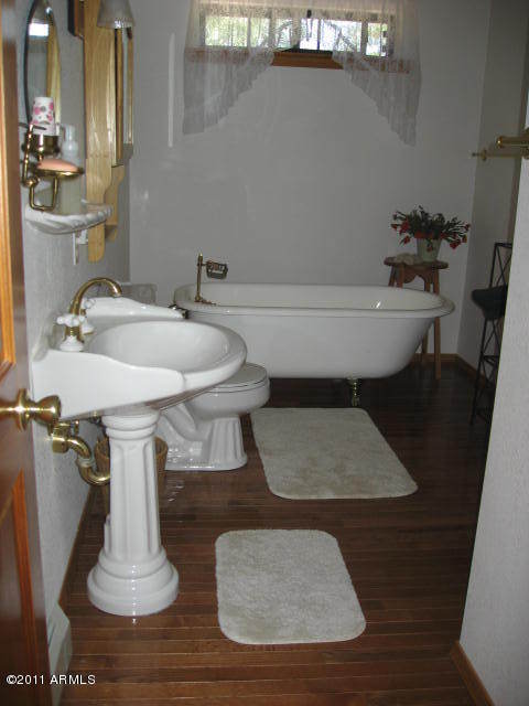 2935 Deer Hill Road Heber, AZ 85928 - Photo 12 of 14 a bathroom with a sink and a mirror