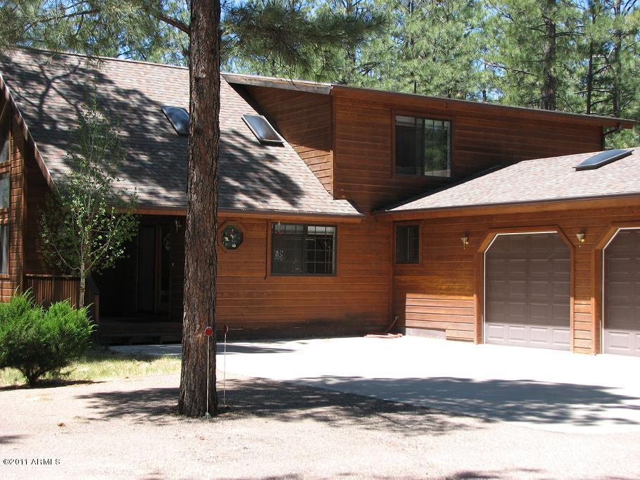 2935 Deer Hill Road Heber, AZ 85928 - Photo 2 of 14 a front view of a house with a yard