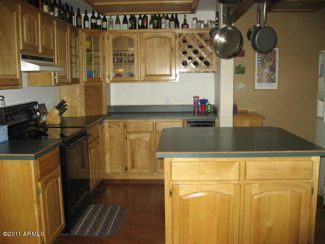 2935 Deer Hill Road Heber, AZ 85928 - Photo 7 of 14 a kitchen with a sink a stove and cabinets