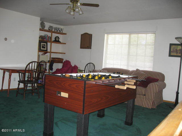 2935 Deer Hill Road Heber, AZ 85928 - Photo 8 of 14 a view of a dining room with furniture window and wooden floor