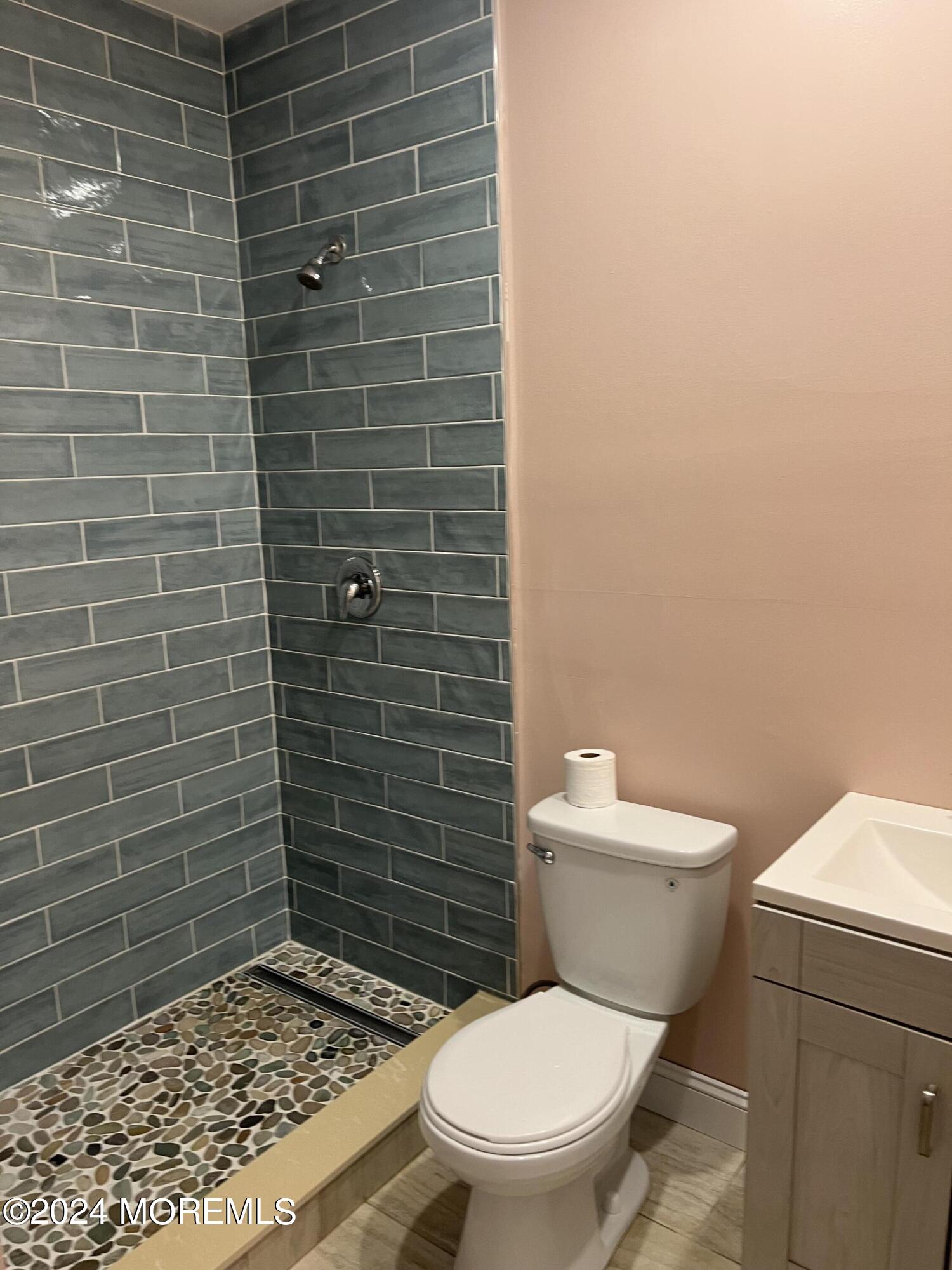 815 Clark Street, Unit 1 Point Pleasant, NJ 08742 - Photo 7 of 10 a bathroom with a toilet and a shower