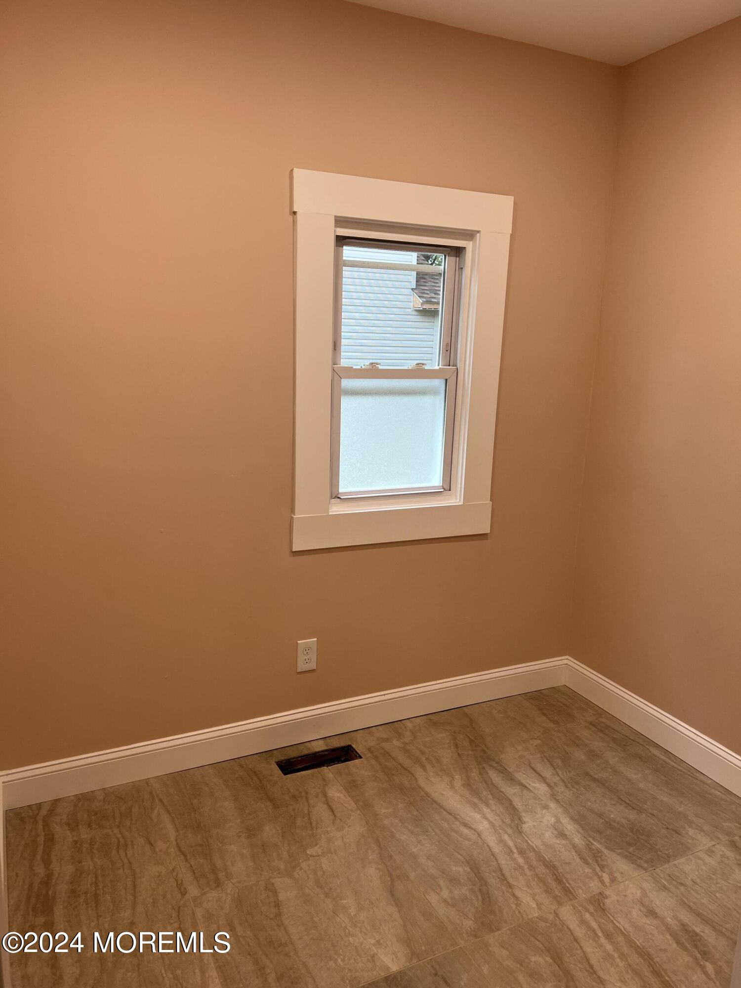 815 Clark Street, Unit 1 Point Pleasant, NJ 08742 - Photo 10 of 10 a view of an empty room with a window