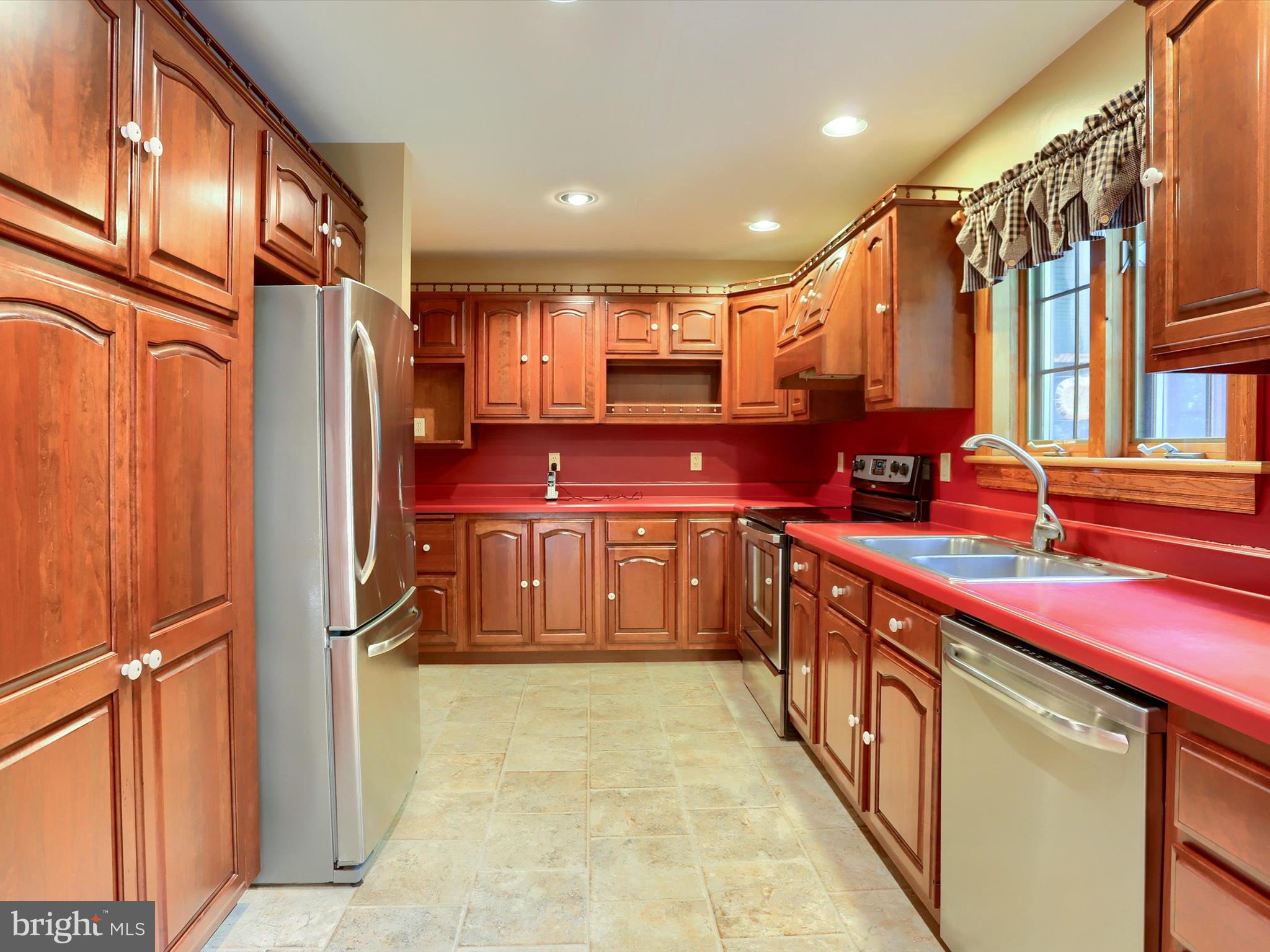 333 Mauger Path Road Port Royal, PA 17082 - Photo 12 of 58 a kitchen with stainless steel appliances a sink stove and cabinets