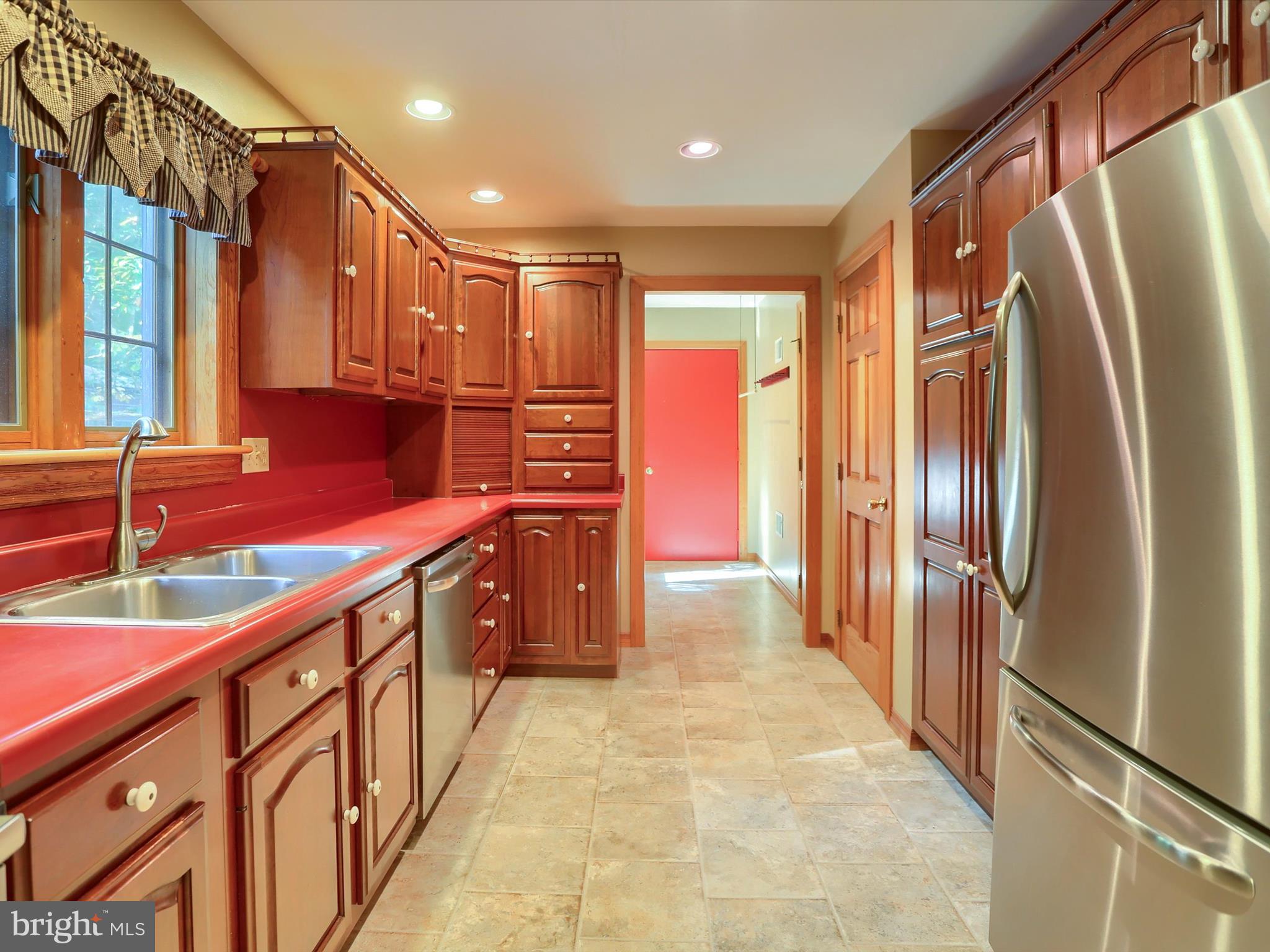333 Mauger Path Road Port Royal, PA 17082 - Photo 13 of 58 a kitchen with stainless steel appliances granite countertop a refrigerator and a sink