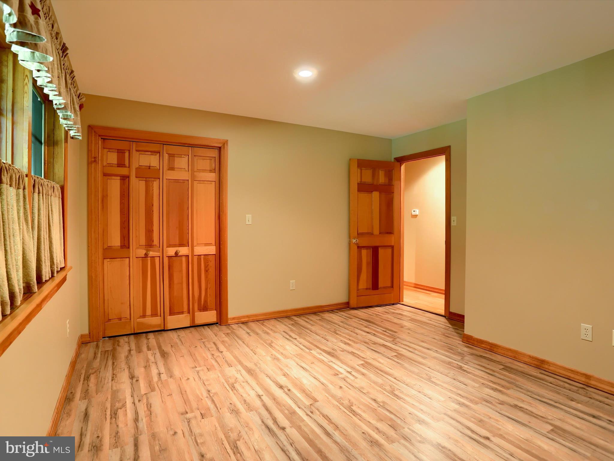 333 Mauger Path Road Port Royal, PA 17082 - Photo 24 of 58 a view of an empty room with wooden floor and a window