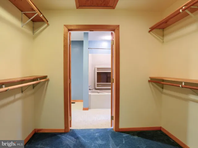 a bathroom with a tub and a shower