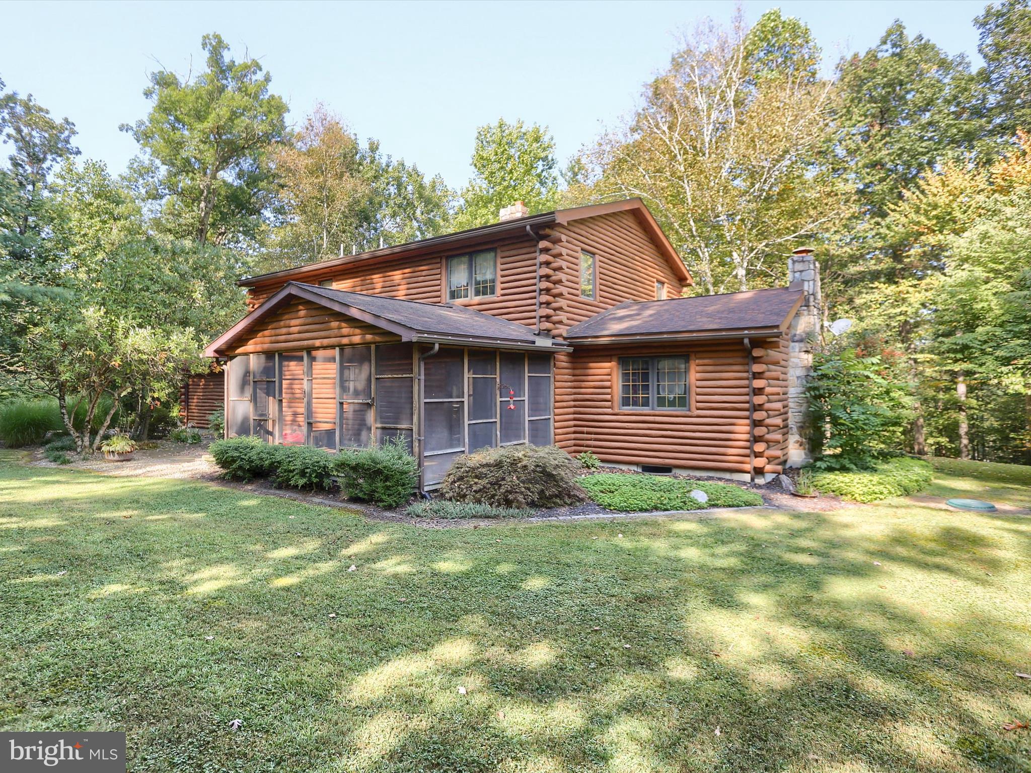 333 Mauger Path Road Port Royal, PA 17082 - Photo 42 of 58 a view of a yard in front of a house with plants and large tree