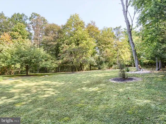 a view of house with backyard and bathroom
