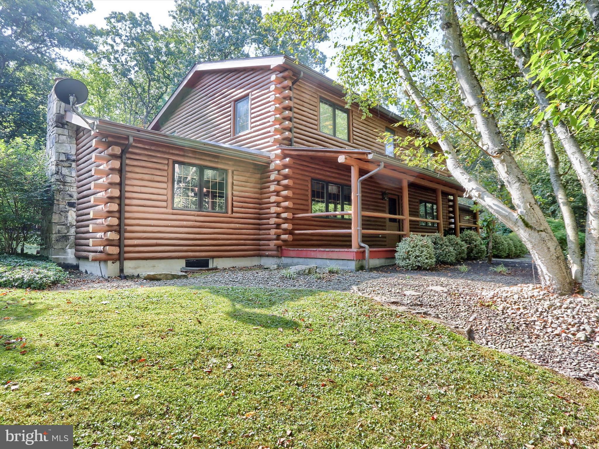 333 Mauger Path Road Port Royal, PA 17082 - Photo 5 of 58 a front view of a house with a garden