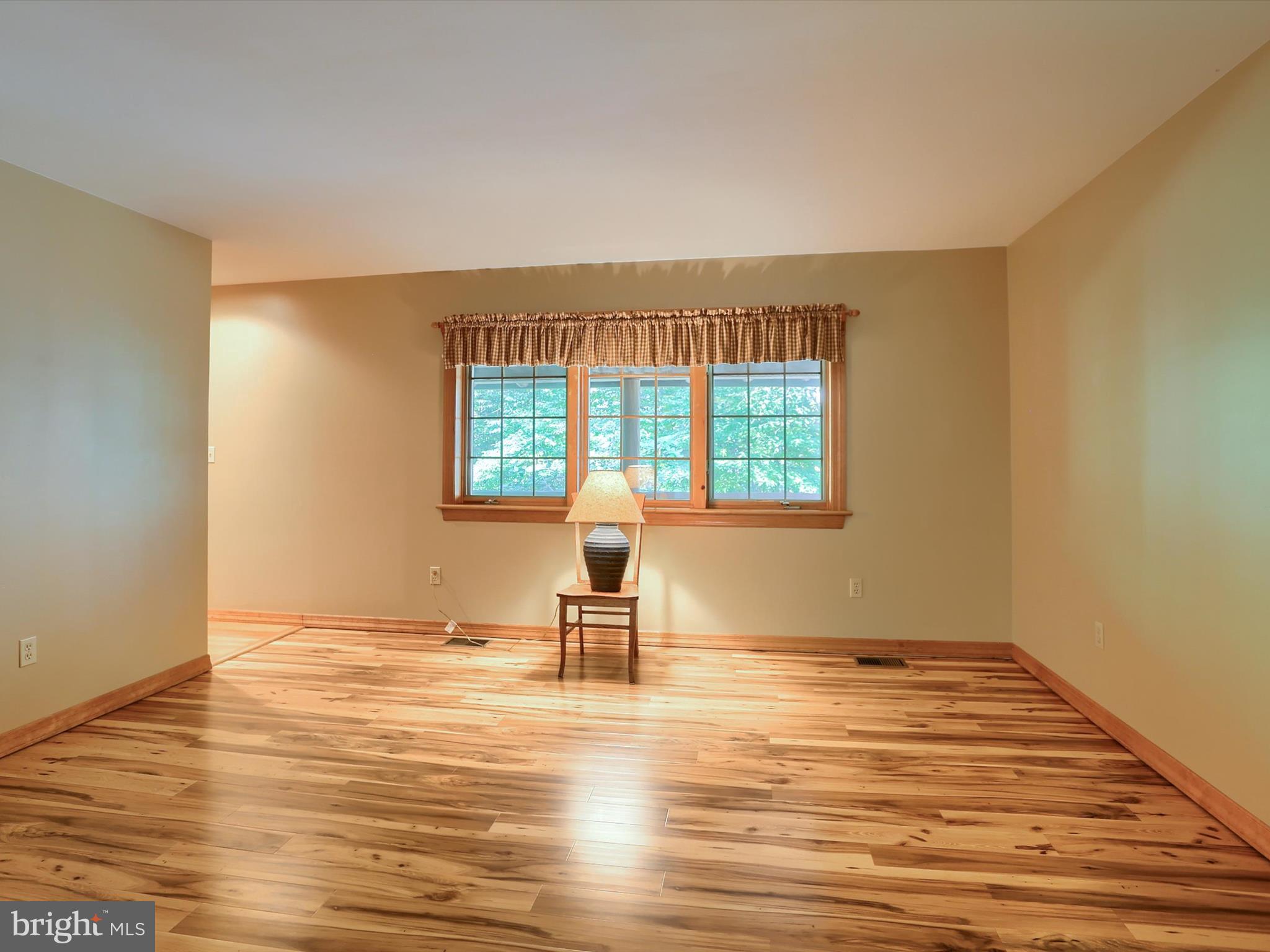 333 Mauger Path Road Port Royal, PA 17082 - Photo 8 of 58 a view of empty room with wooden floor and fan