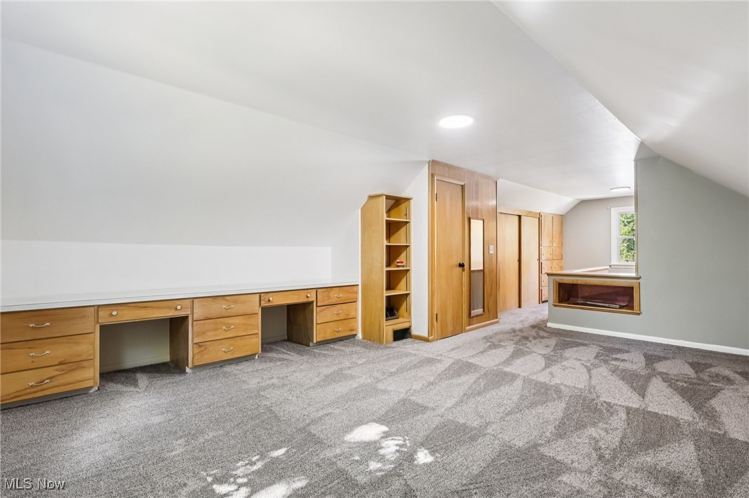5898 Keller Road Akron, OH 44319 - Photo 16 of 32 Bonus room with lofted ceiling, light carpet, and a desk