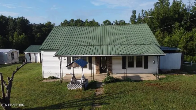 an aerial view of a house with a garden