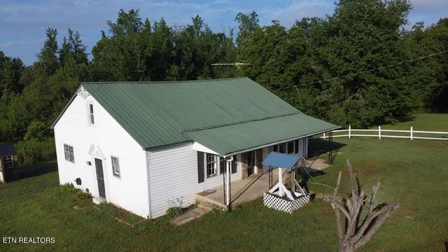 a aerial view of a house with backyard