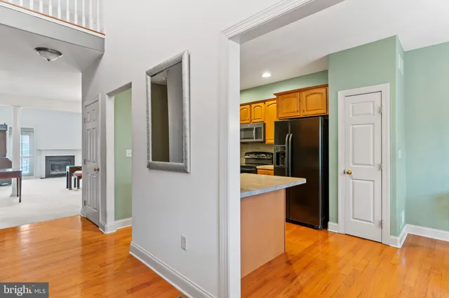 a view of a living room with a wooden floor