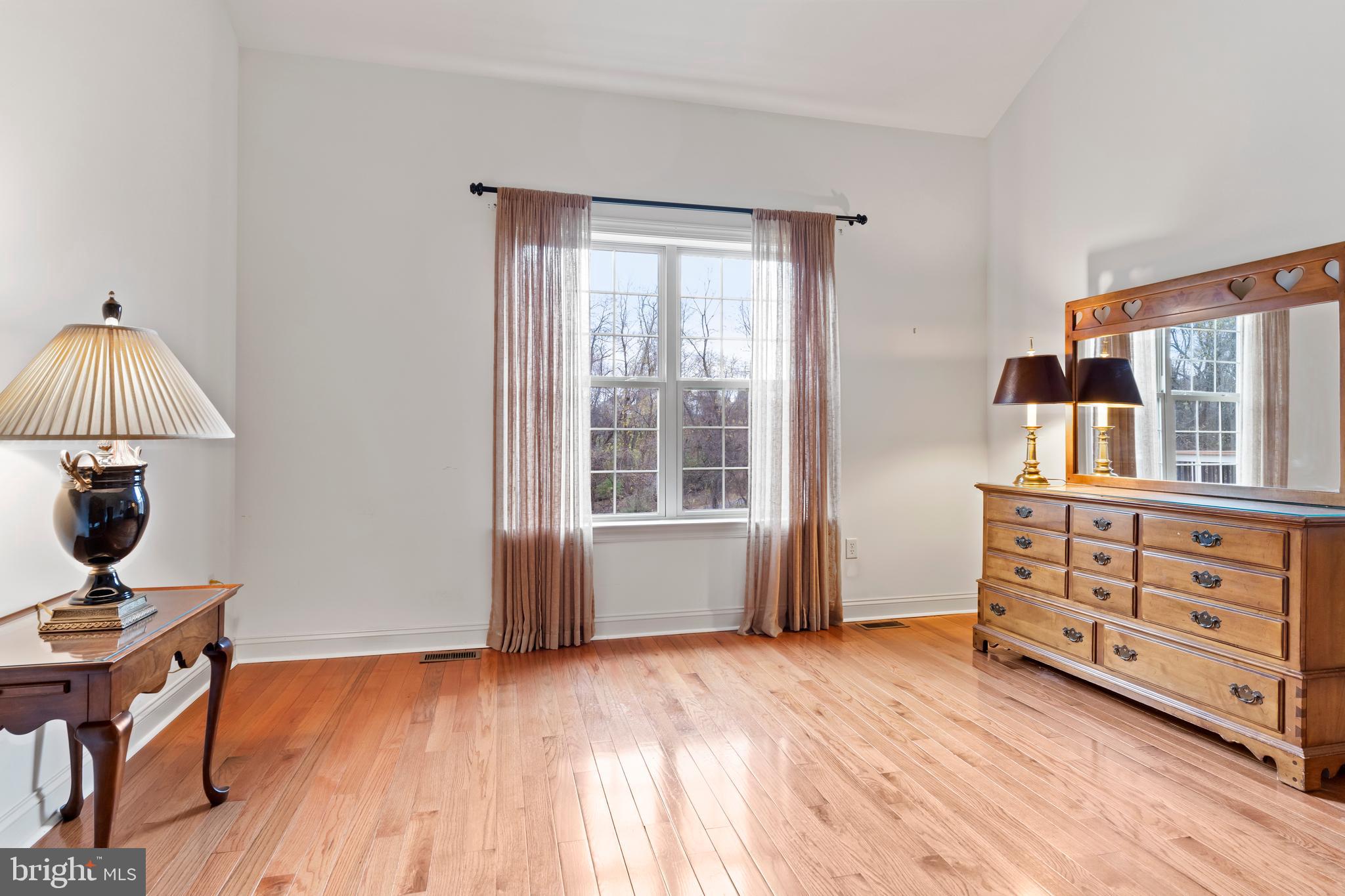 1920 Roxbury Court Mechanicsburg, PA 17055 - Photo 19 of 34 a view of a bedroom with furniture window and wooden floor