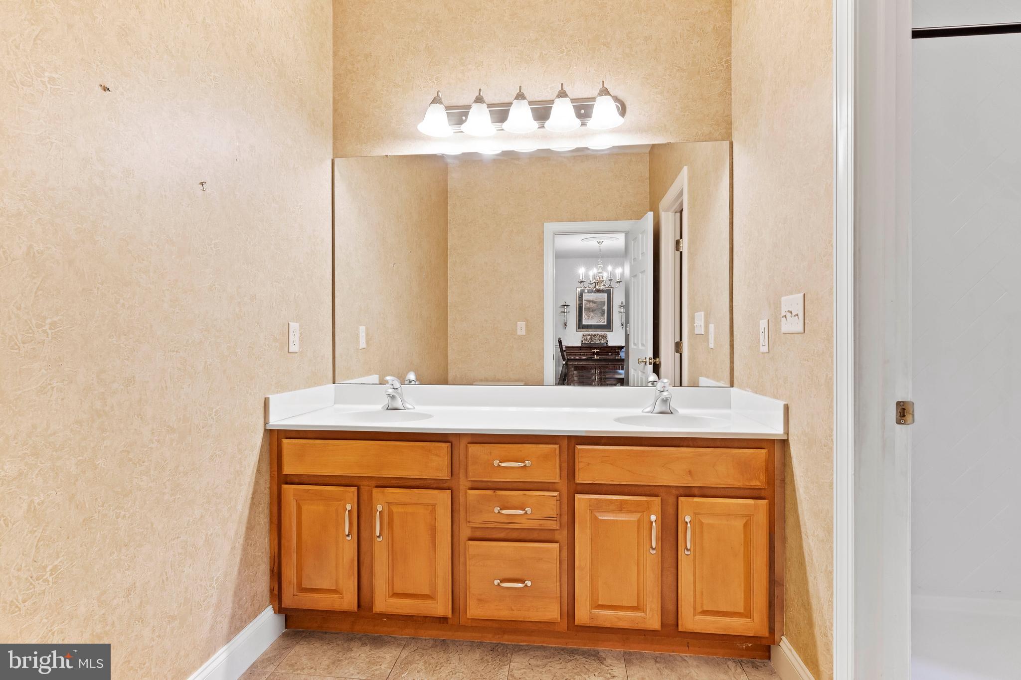 1920 Roxbury Court Mechanicsburg, PA 17055 - Photo 20 of 34 a bathroom with a granite countertop sink and a mirror