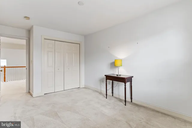 a view of balcony with wooden floor and fence