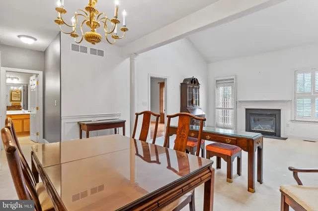 a dining room with furniture and a fireplace