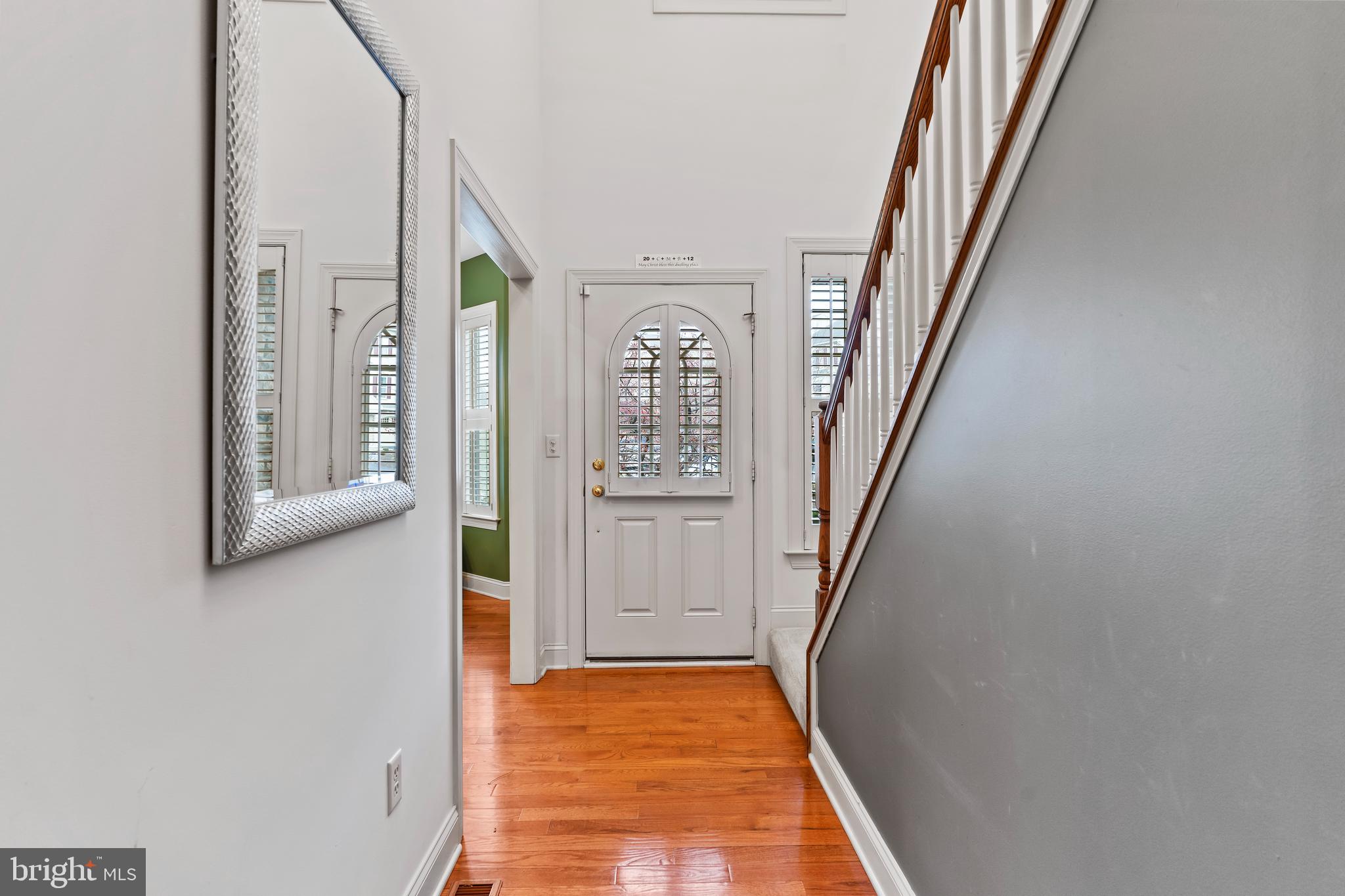 1920 Roxbury Court Mechanicsburg, PA 17055 - Photo 10 of 34 a view of a hallway with wooden floor and staircase