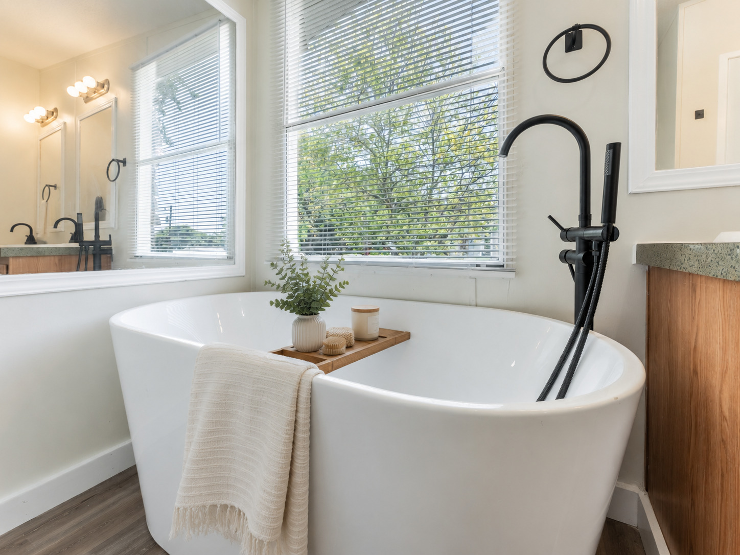 171 Railyard Drive Kyle, TX 78640 - Photo 17 of 20 a bath tub sitting in a bathroom next to a window