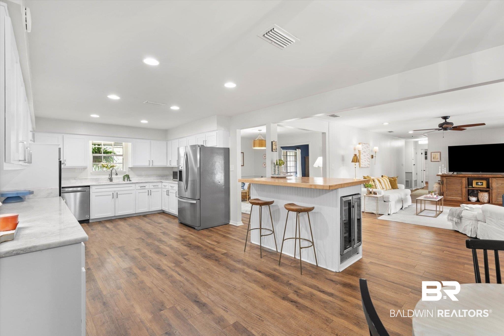 254 Woodlands Avenue Mobile, AL 36607 - Photo 49 of 50 Kitchen featuring open floor plan, recessed lighting, white cabinets, stainless steel appliances, and dark wood-type flooring