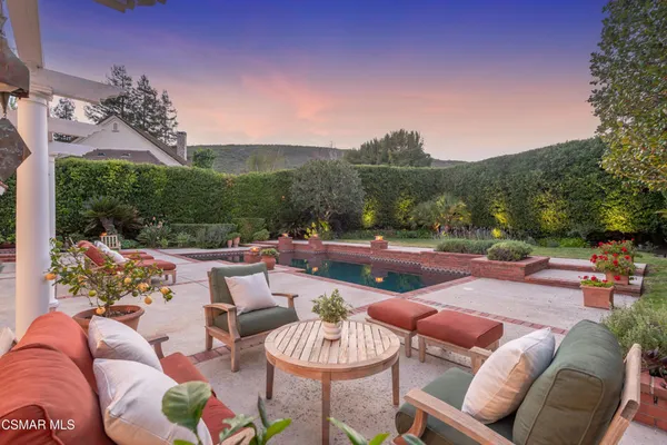 a outdoor living space with furniture potted plant and outdoor view