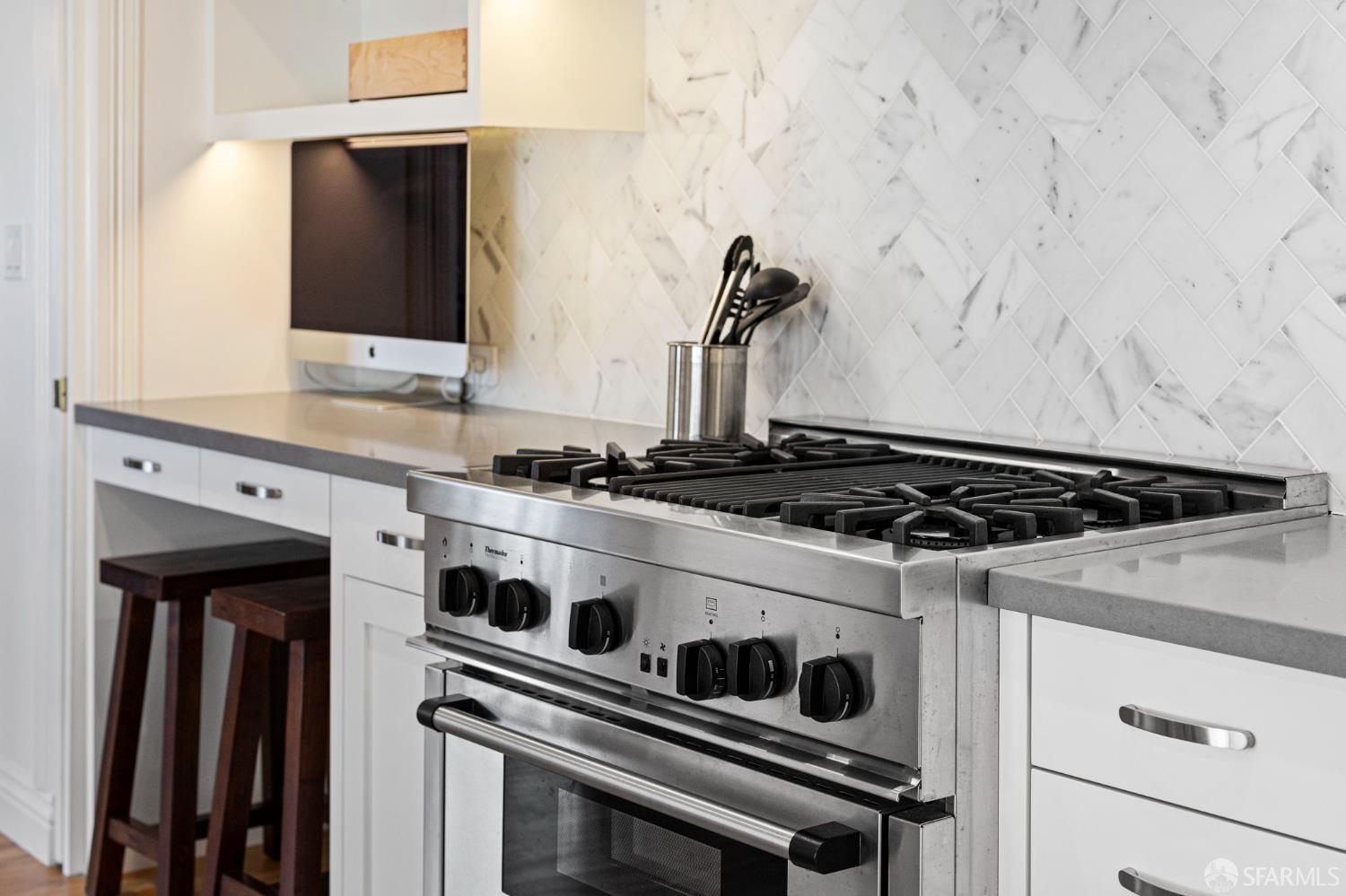 2145 Franklin Street, Unit 1 San Francisco, CA 94109 - Photo 16 of 46 a stove top oven sitting inside of a kitchen