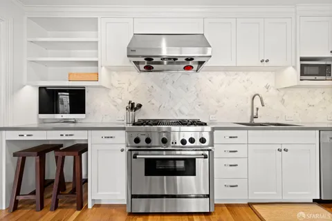 a kitchen with cabinets and appliances