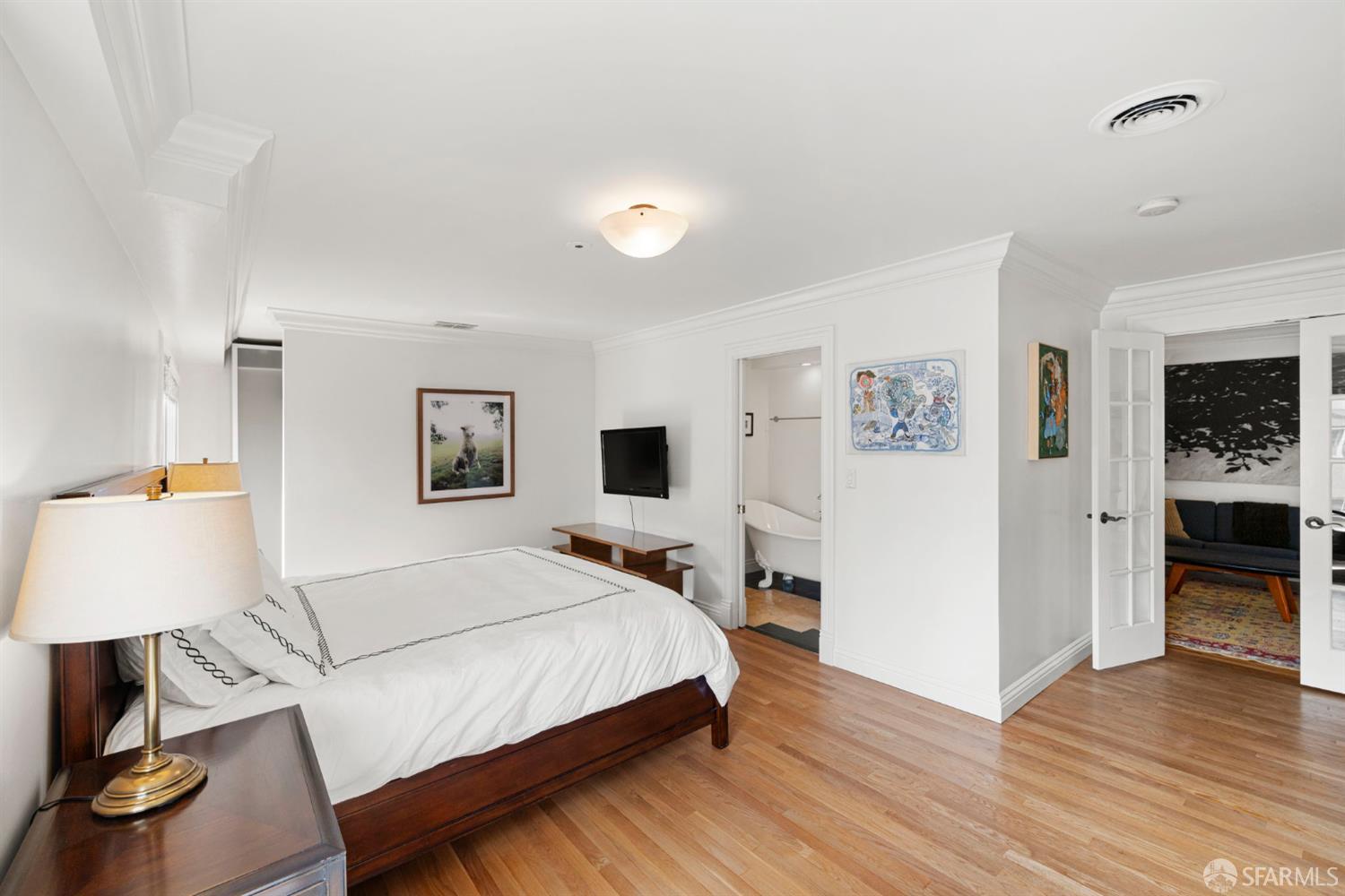 2145 Franklin Street, Unit 1 San Francisco, CA 94109 - Photo 24 of 46 a bedroom with a bed and a lamp on table