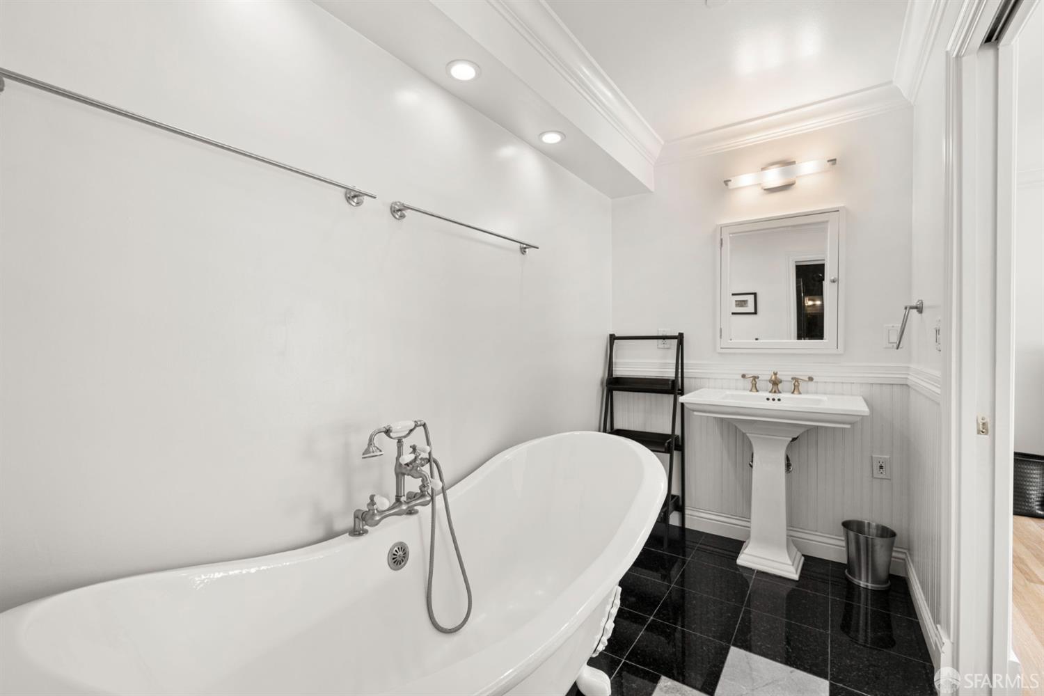 2145 Franklin Street, Unit 1 San Francisco, CA 94109 - Photo 26 of 46 a bathroom with a sink mirror and toilet