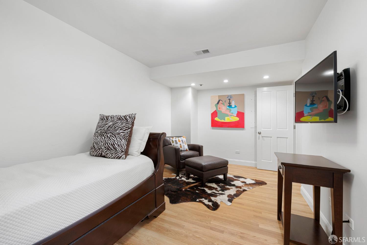 2145 Franklin Street, Unit 1 San Francisco, CA 94109 - Photo 34 of 46 a bedroom with a bed a desk and chair