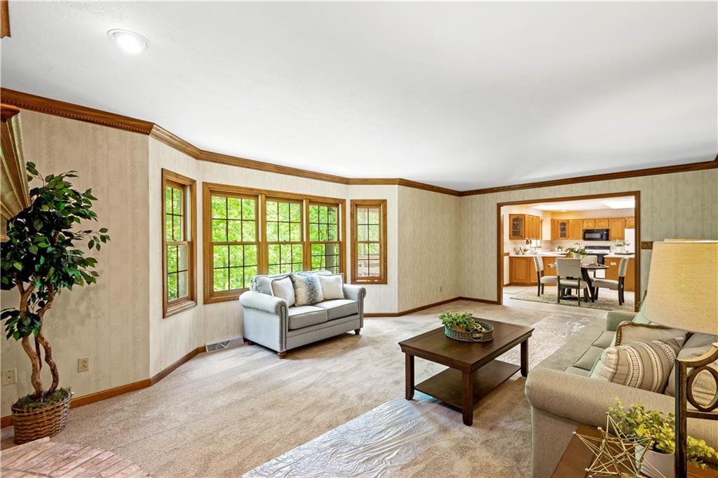203 Oak Leaf Drive Mars, PA 16046 - Photo 11 of 25 a living room with furniture and a large window