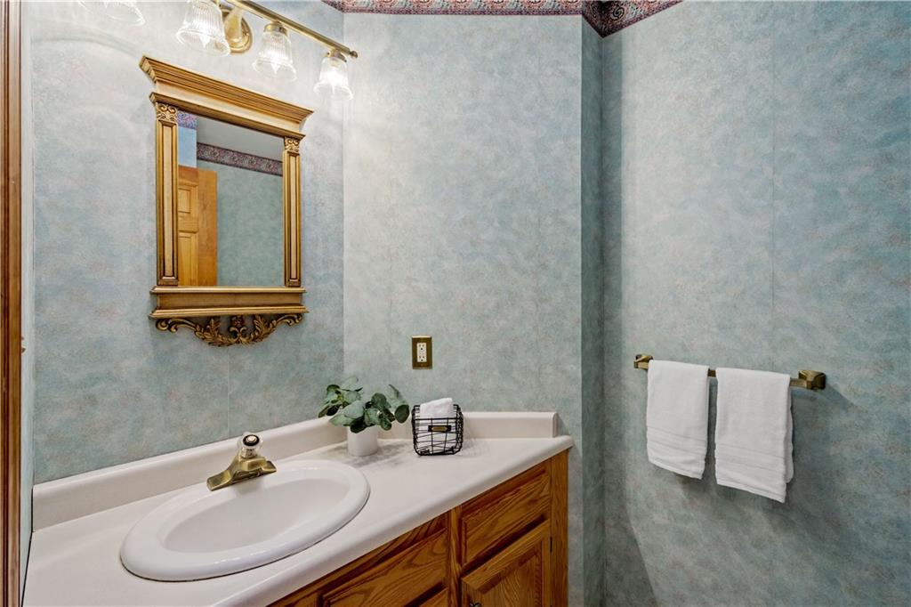 203 Oak Leaf Drive Mars, PA 16046 - Photo 15 of 25 a bathroom with a sink and a mirror