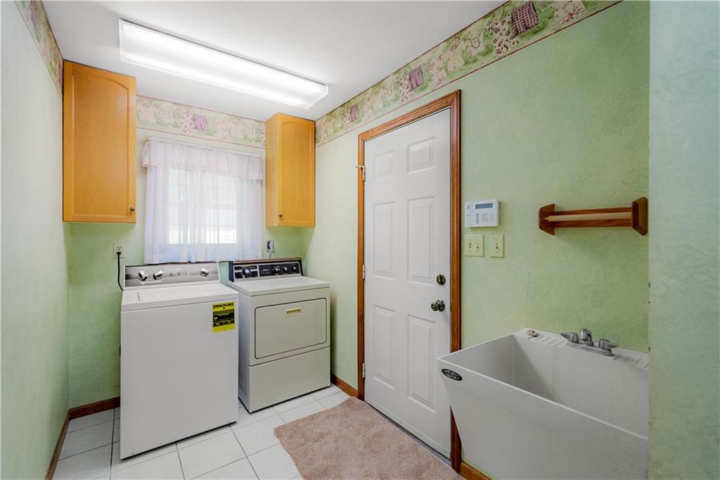 203 Oak Leaf Drive Mars, PA 16046 - Photo 16 of 25 a room with storage and utility