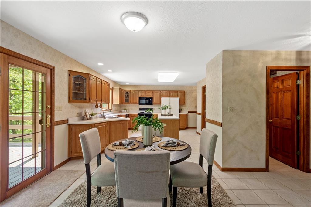 203 Oak Leaf Drive Mars, PA 16046 - Photo 8 of 25 a view of a dining room with furniture window and outside view