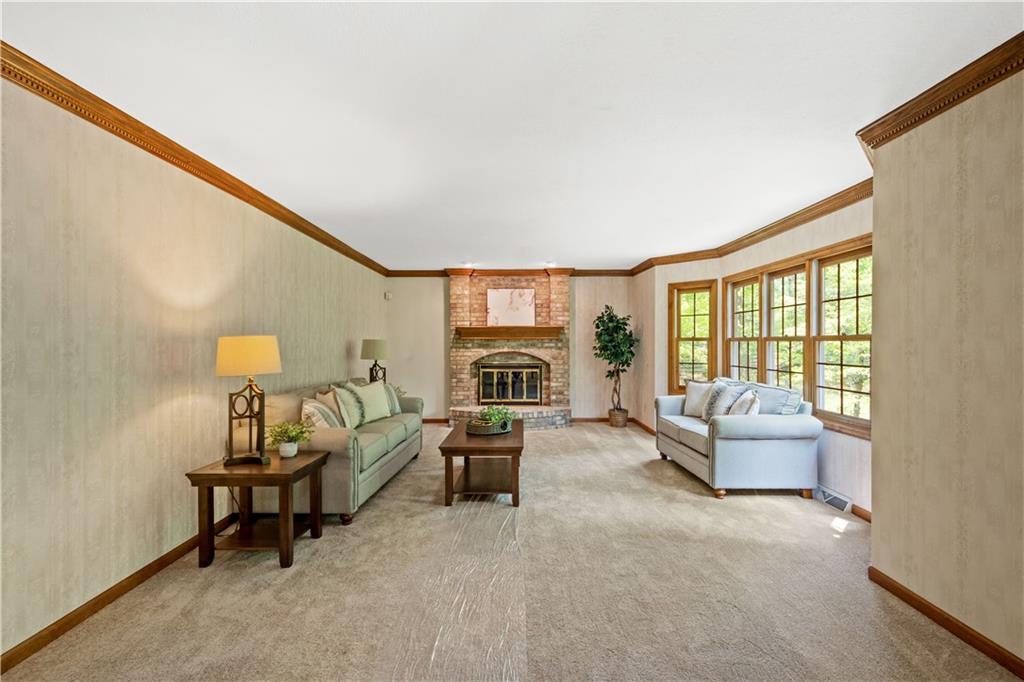 203 Oak Leaf Drive Mars, PA 16046 - Photo 10 of 25 a living room with furniture and a floor to ceiling window
