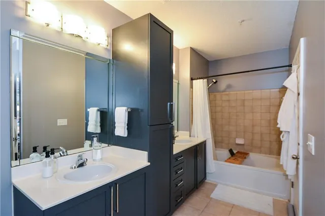 a bathroom with a sink toilet shower and bathtub