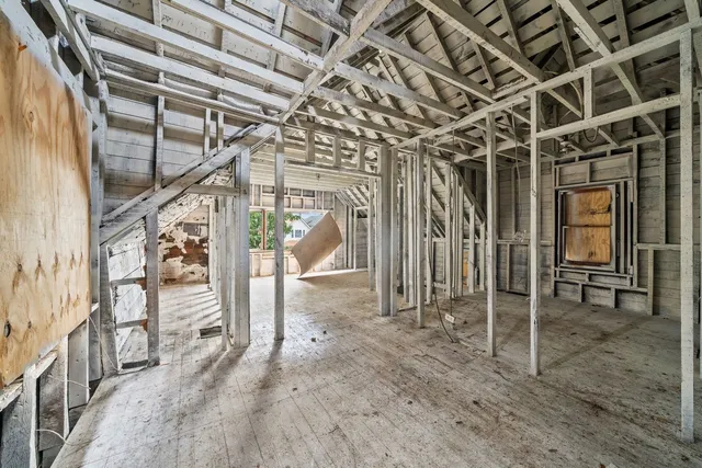 a backyard of a house with plants and trees
