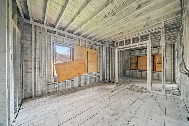 a view of entryway with wooden door