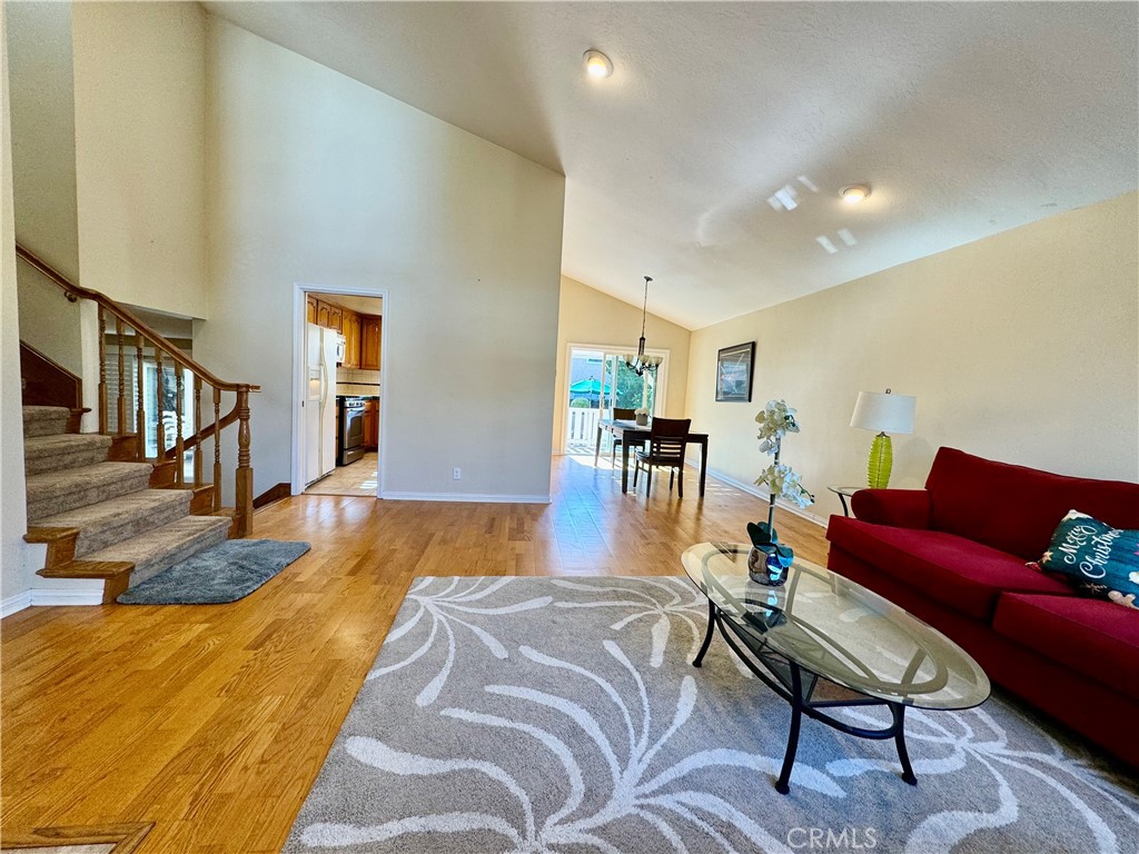 3632 Myrtle Street Irvine, CA 92606 - Photo 2 of 40 a living room with furniture and a dining table with wooden floor
