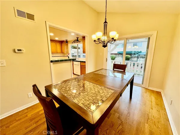 a dining room with a table and chairs