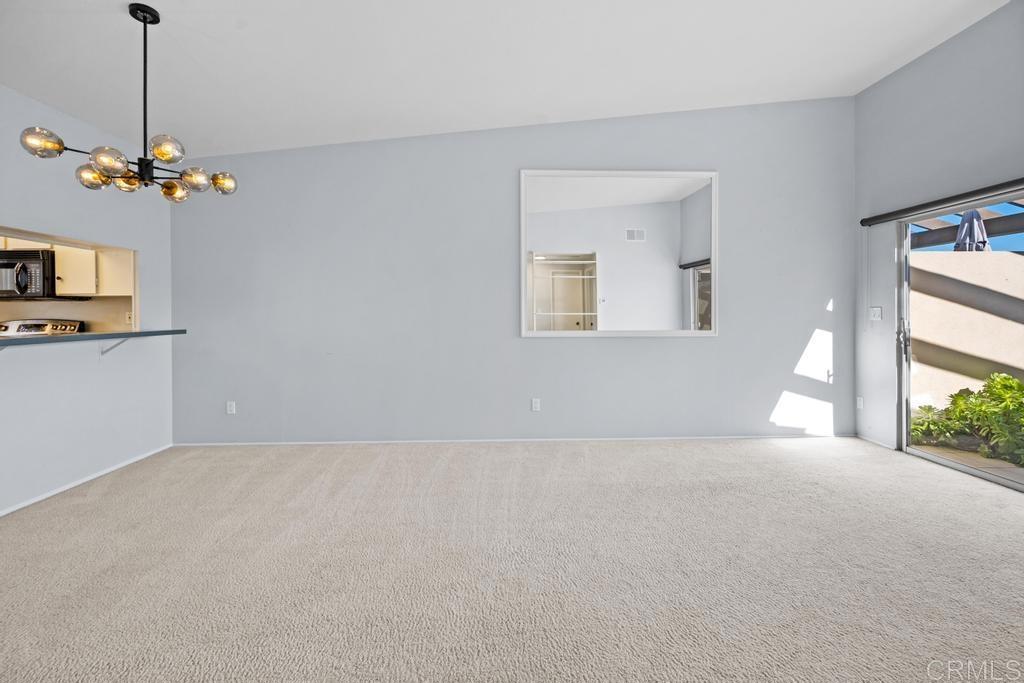 12228 Rancho Bernardo Road, Unit B San Diego, CA 92128 - Photo 13 of 35 a view of an empty room with a window