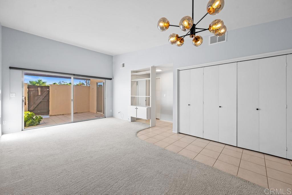 12228 Rancho Bernardo Road, Unit B San Diego, CA 92128 - Photo 2 of 35 a view of an empty room with a window