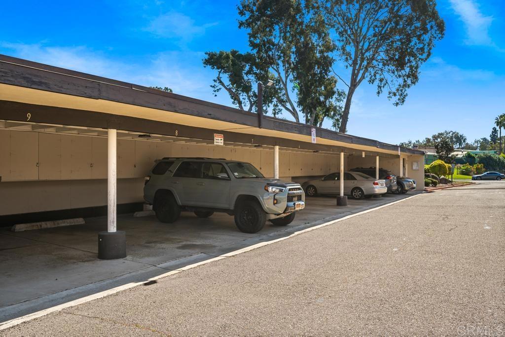 12228 Rancho Bernardo Road, Unit B San Diego, CA 92128 - Photo 26 of 35 a view of a cars in front of a house