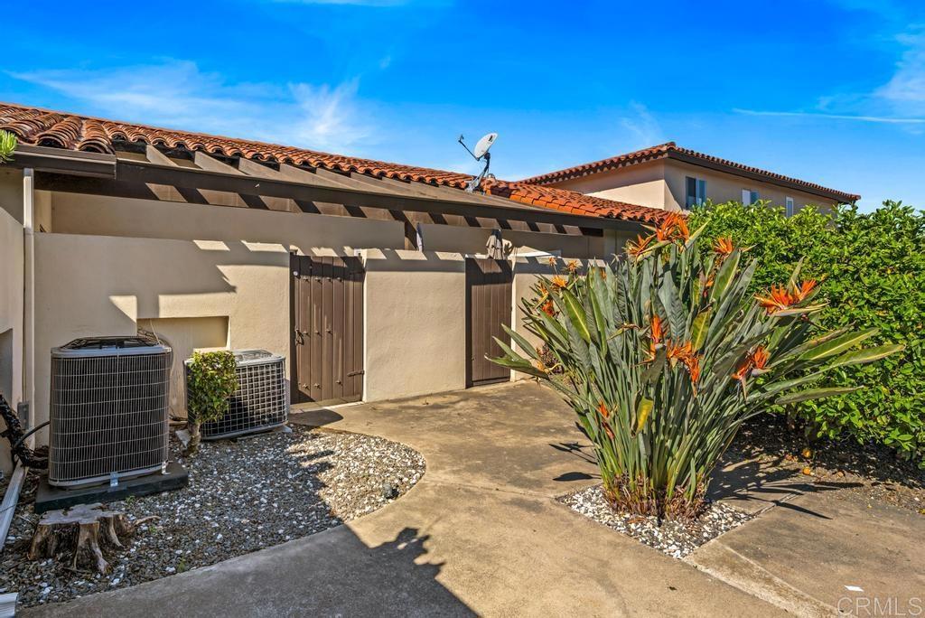 12228 Rancho Bernardo Road, Unit B San Diego, CA 92128 - Photo 27 of 35 a view of a house with a garage