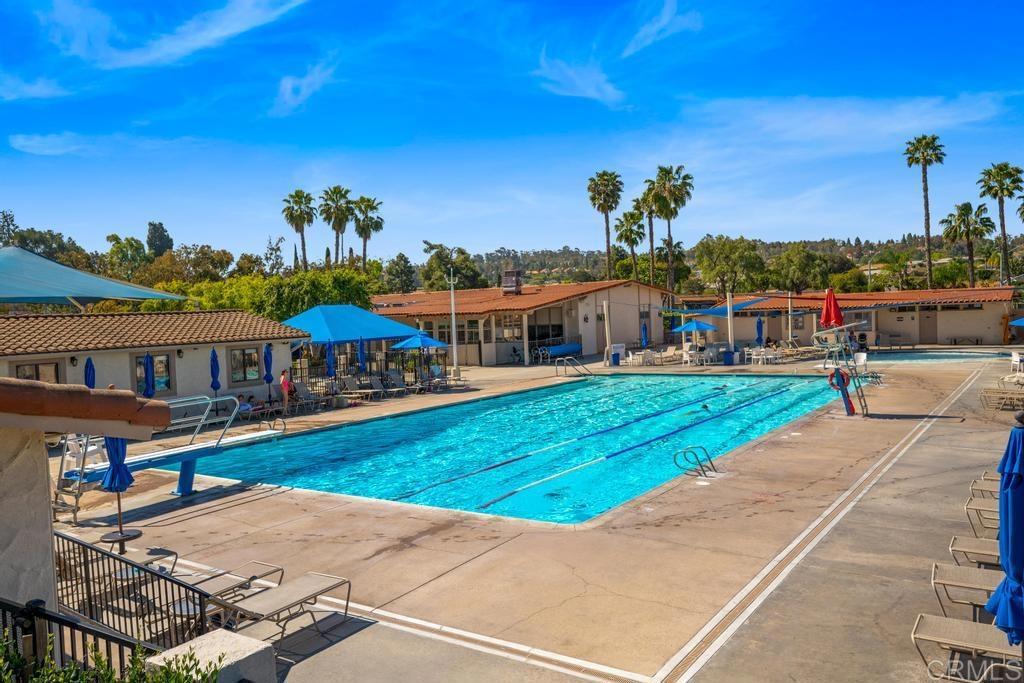 12228 Rancho Bernardo Road, Unit B San Diego, CA 92128 - Photo 32 of 35 a view of a house with a yard