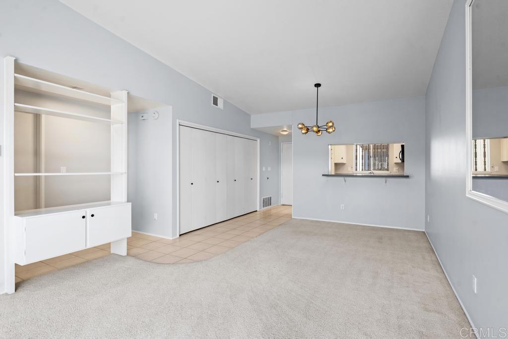 12228 Rancho Bernardo Road, Unit B San Diego, CA 92128 - Photo 10 of 35 an empty room with cabinet and windows